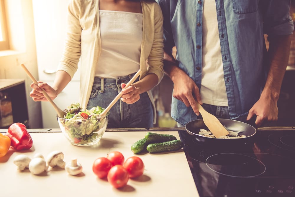 Couple preparing meal together