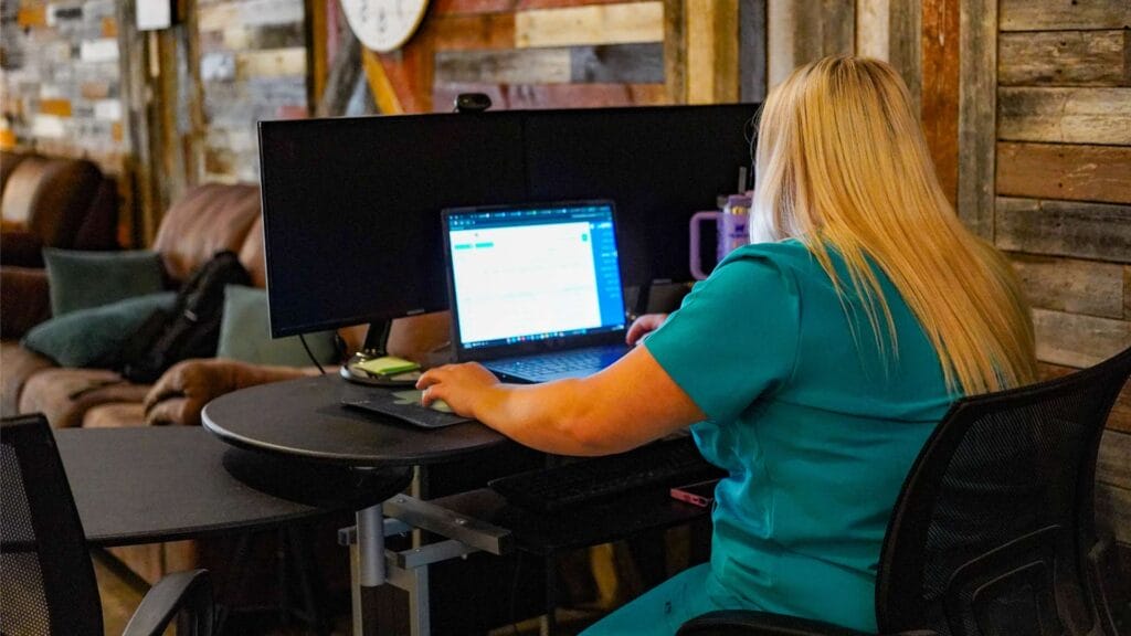 Eating Disorder Solutions Admissions Process Nurse at Computer